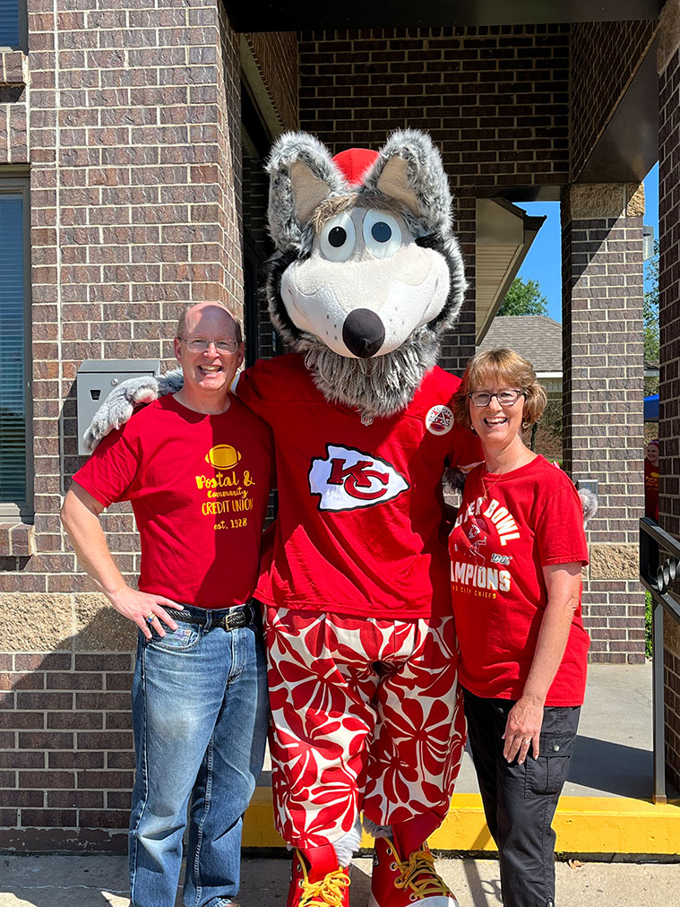 Postal & Community with the KC Chiefs mascot.