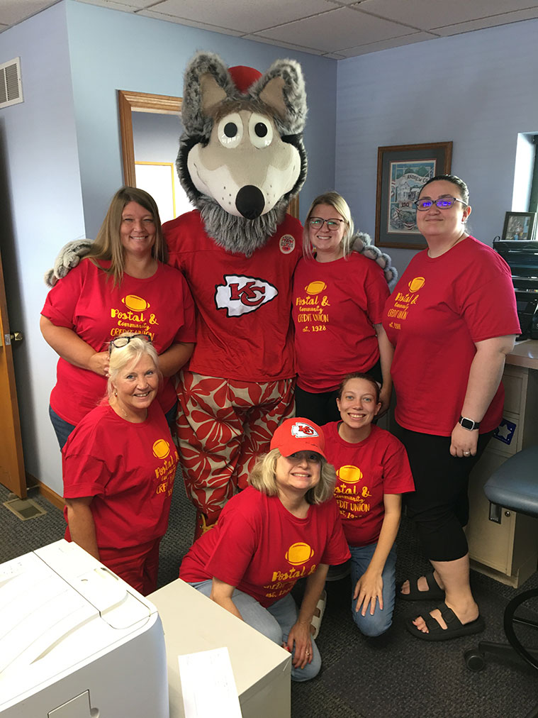 Credit union employees with the KC Chiefs mascot.